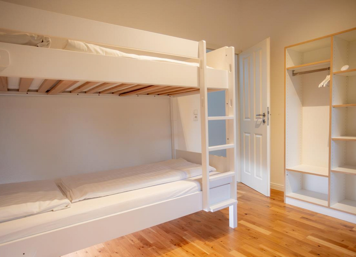 Gemütliches Familienzimmer – helles Etagenbett für große & kleine Gäste in Dock 2